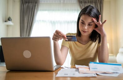 A woman worrying over her finances.