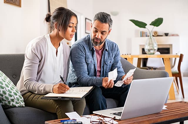 A couple looking over their finances.