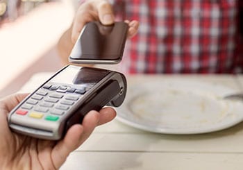 Person paying with tap pay