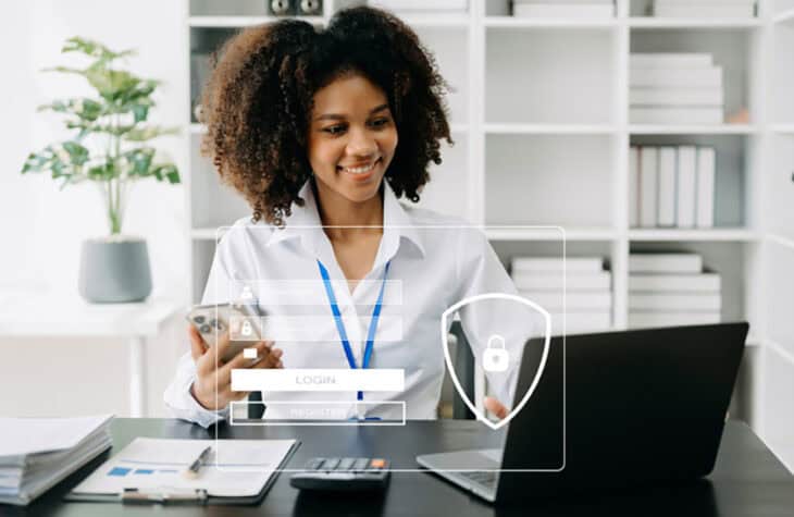 Woman securely logging into tablet in office