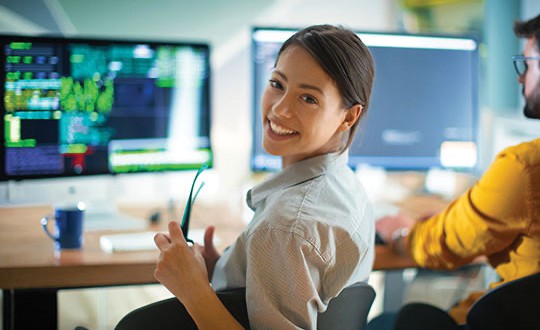 woman sitting at desk working