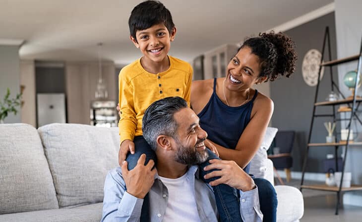 Family playing on sofa