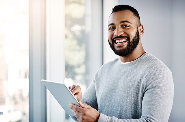 Business owner working on remote deposit from their tablet