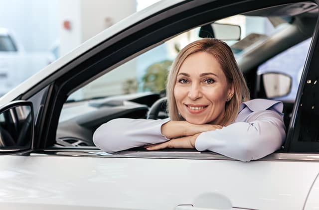 Woman shopping for a leased car.