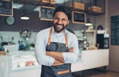 A confident business man laughing.