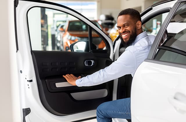 Person considering a car to lease at the dealership