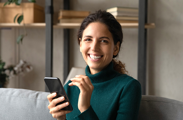 woman conducting telephone banking transactions from her smartphone