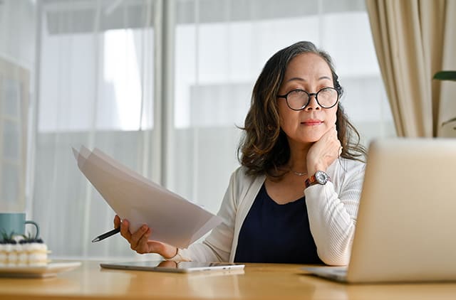 A women thinking about her financial plans.