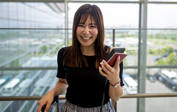 Business woman on the go using the Business Mobile App for Business Banking