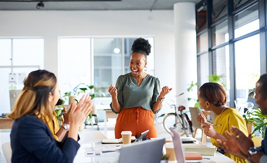 enthusiastic presenter gets applause in conference room