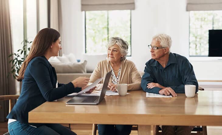 Retirement couple consulting with financial planner