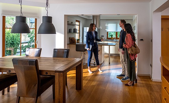 state agent talking with couple