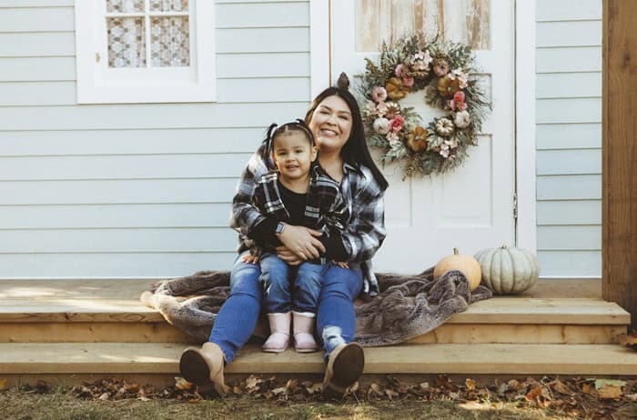 Little Girl and Mom on a Charming Rustic Porch