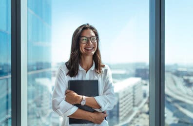 A business woman smiling at the camera.