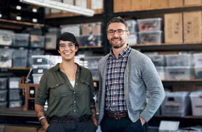 Portrait of a confident man and woman working together in a workshop