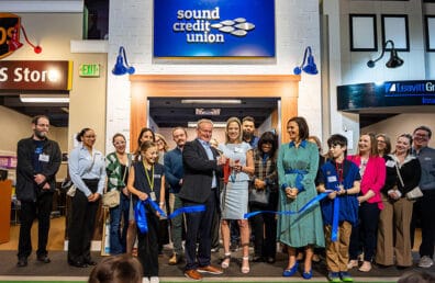 President and CEO of Sound Credit Union, Don Clark, cutting the ribbon for the new Sound Credit Union installation at JA.